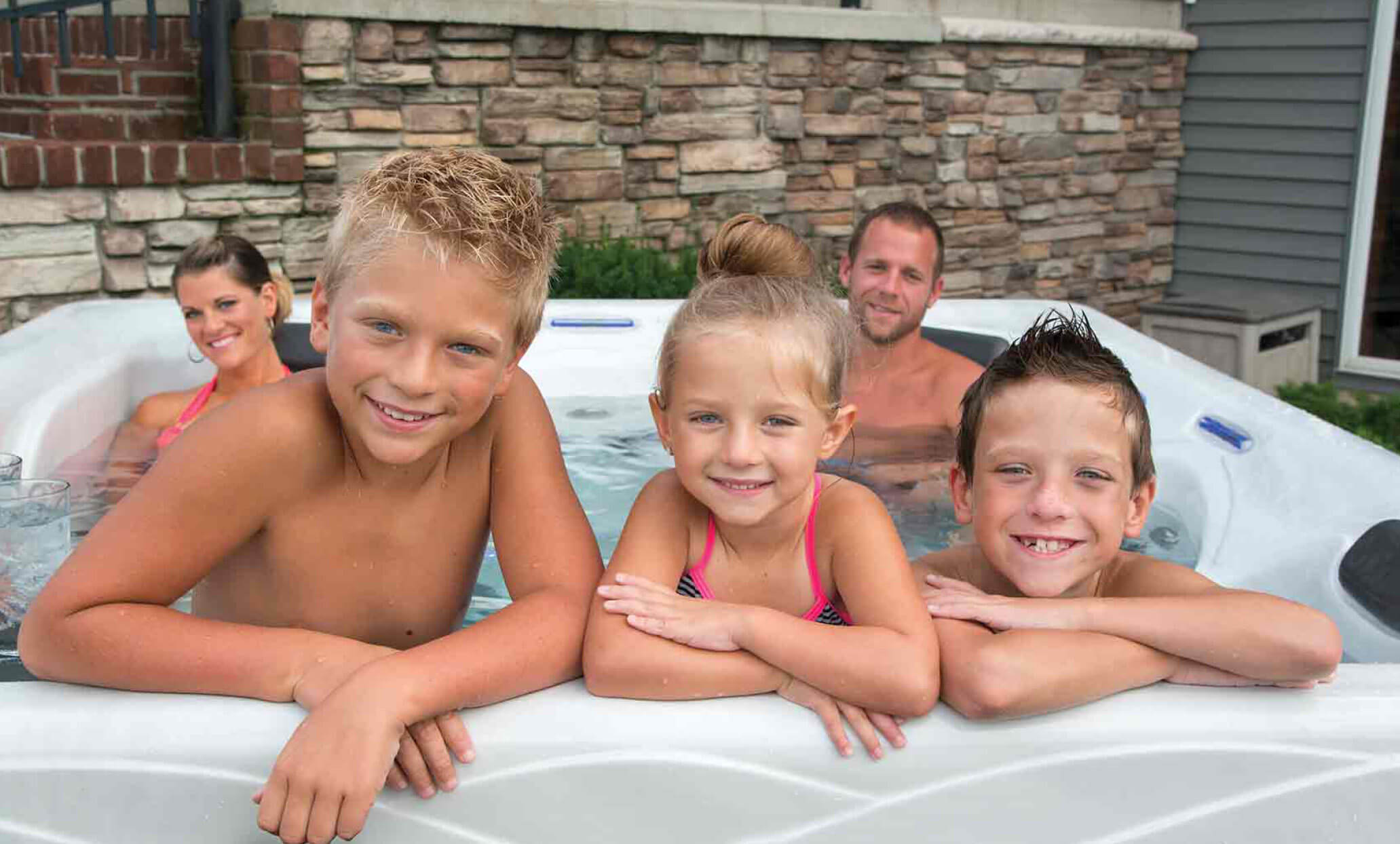 Family in a Master Spas hot tub